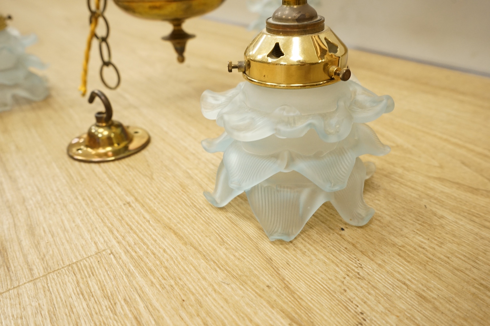 A Victorian brass three branch ceiling light with blue glass shades